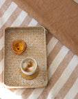Hazelnut and Stripe linen bedding with coffee and pastry 