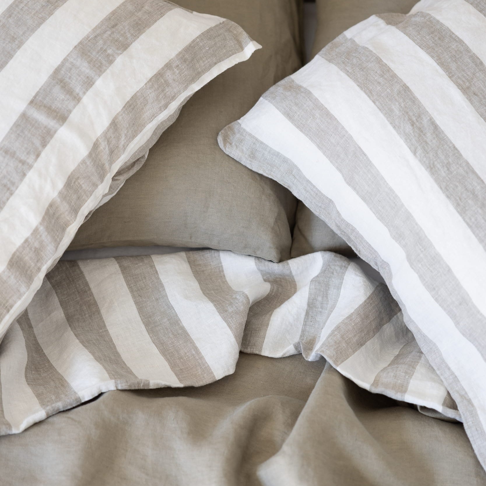 Tess and Tess Stripe linen bedding, reversible, mossy green and ivory 